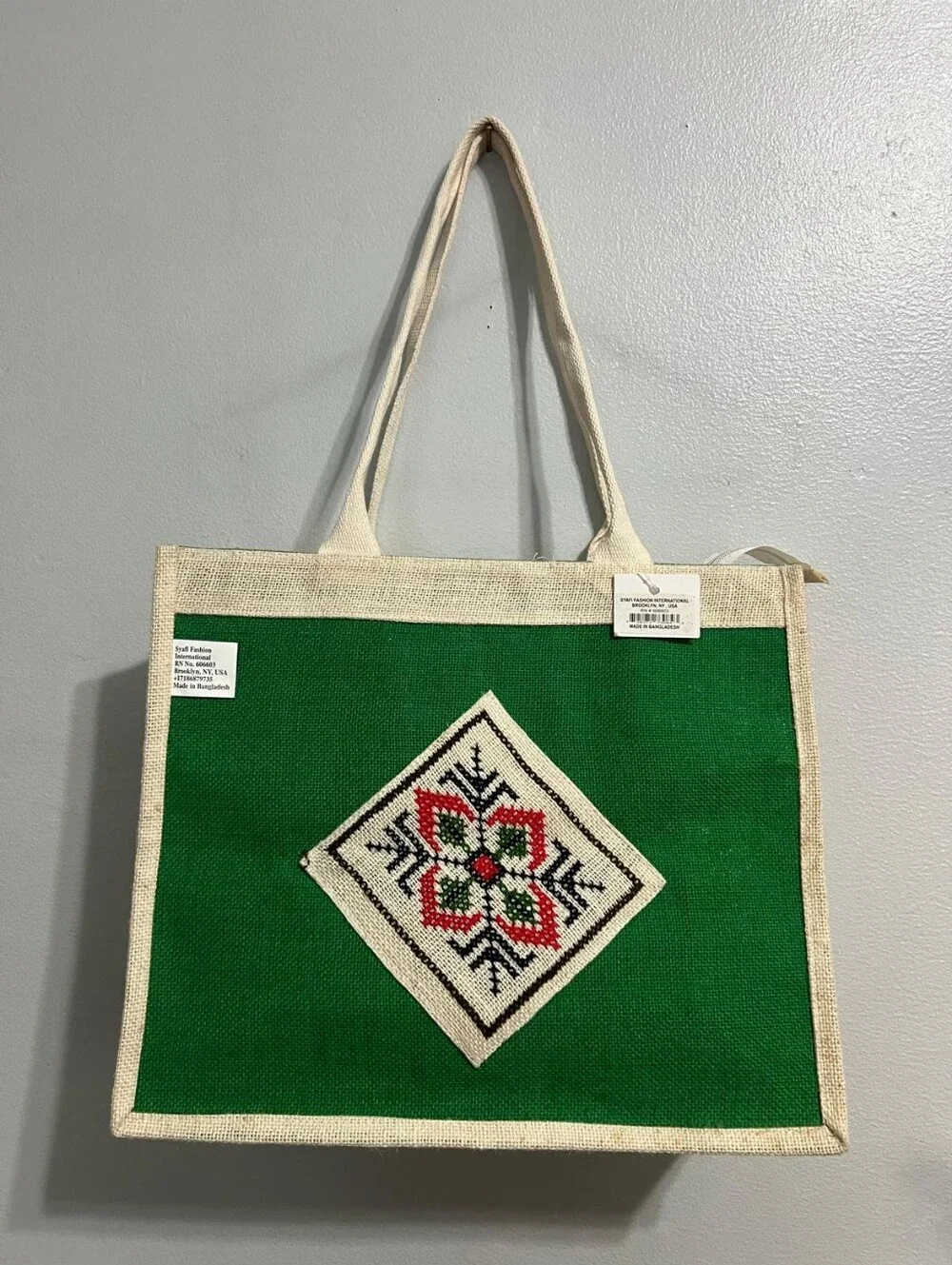 Boho-Chic Natural Jute Handbag with Cross-Stitch Embroidery.
